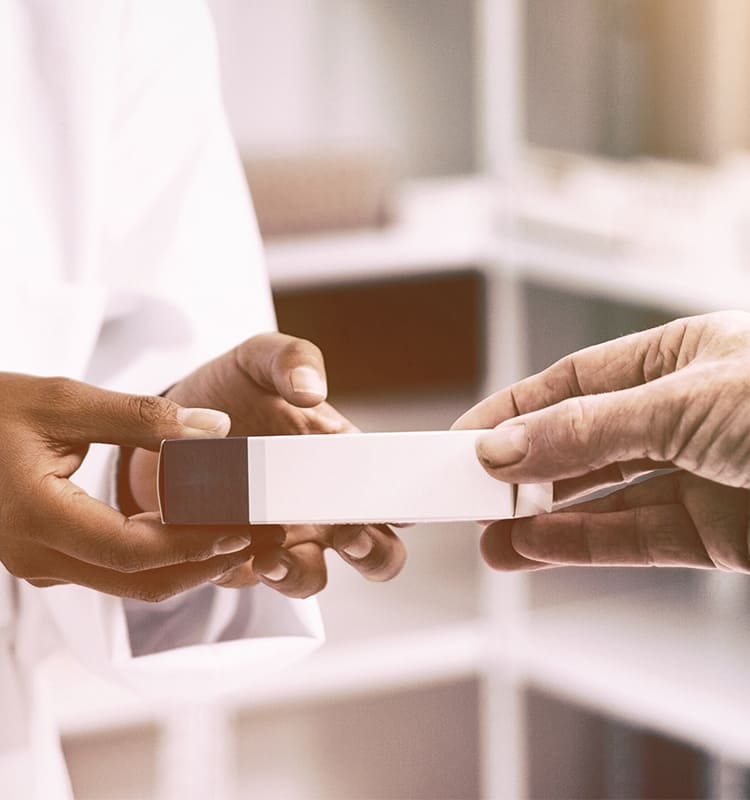 pharmacist working with a customer